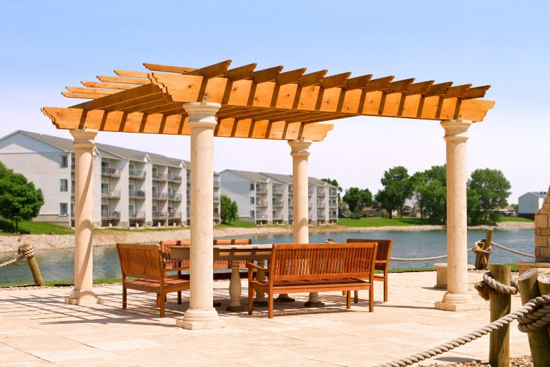 free standing pergola with wood furnoture