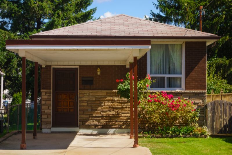 An attached carport that can fit a small car to your home.